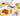 Two bowls of spaghetti with a bottle of ItalianaVera sauce on a wooden surface.