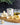 Olive oil canister with garlic and pasta on a wooden board