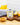 Lemon extra virgin olive oil tin on a wooden cutting board next to sliced lemons
