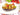 Fusilloni pasta dish served in an eggplants with tomatoes and cheese
