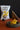 Truffle chips in a dark plate with a bag of truffle chips in the background