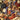 Close-up of a mix of dried herbs and flowers including blue and orange elements.