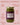 Jar of Zia Pia pesto alla genovese with purple label on a pink background
