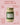 Jar of Zia Pia artichoke and garlic spread with product details on a pink background