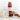 Jar of Zia Pia tomato sauce on a white background with pasta and garlic