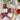Three bottles of Zia Pia tomato sauces on a textured surface with a wooden spoon and plant in the background.