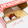 Zia Pia gift set with pasta, sauce, and extra virgin olive oil on a white background