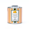 Orange and white striped tin of Galantino orange olive oil on a white background