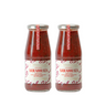 Two bottles of Zia Pia sauce on a white background