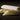 Close up of organic penne on a dark background