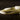 Close up of trenette pasta on a dark background. 