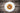 Arborio rice dish on a white plate on a dark wooden table
