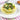 Stuffed caccavelle with spinach and meat on a white plate with a striped tablecloth.