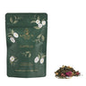 Tea package labeled 'Camille' with tea leaves on a white background