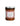 A jar of Perche ci Credo Eggplant Caponata, showing a dark colored spread with visible pieces of eggplant and raisins.