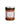 A jar of Perche ci Credo Eggplant Caponata, showing a dark colored spread with visible pieces of eggplant and raisins.