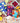 Three colorful tea bags with fruit-themed designs on a wooden surface with fruits around.