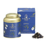 A tin and box of La Via del Té Emma loose leaf tea, with a visual representation of the tea leaves.
