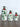 Three ceramic containers of extra virgin olive oil in varying sizes with hand painted green designs