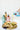 Turquoise ceramic bottle of olive oil being poured next to bread with more ceramic olive oil bottles in the background