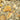 Assorted dried herbs and leaves on a textured surface
