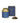 A gold aluminum tin of Segreto dei Medici loose leaf tea with a blue label, accompanied by a pile of dried tea leaves and a box with matching design.