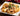 Plate of paccheri Lisci with seafood and tomatoes