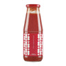 A glass jar containing red tomato puree with a red cap and a label featuring white hearts pattern.