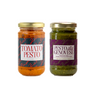 Two jars of  Zia Pia pesto, one tomato pesto and one pesto alla genovese, on a white background.