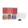 A gift box set containing two aluminum tins of loose leaf tea and a gold stainless steel tea infuser, with packaging that features the brand La Via del Té and the name Firenze.