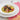 Scialatiellli pasta dish with shell fish and peas in a white bowl