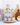 Wooden tiered spice rack with various tins of flavored olive oils on a white counter