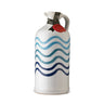 A ceramic bottle of extra virgin olive oil with a hand-painted blue and white wave pattern.