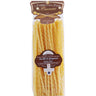 Packaged Fusilli IGP pasta in a clear plastic bag with branding and product information displayed on a label on a white background