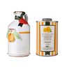 White ceramic olive oil bottle with hand painted orange design and orange and white striped olive oil tin. 