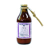 A glass bottle of Perche Ci Credo tomato sauce with olives and capers with a purple label on a white background