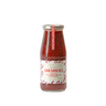 A glass jar of Zia Pia arrabbiata tomato sauce with a white label, displaying the product name and a brief description.