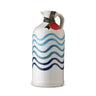 A ceramic bottle of extra virgin olive oil with a hand-painted blue and white wave pattern.