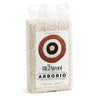 Packaged Arborio rice in a clear plastic bag with a label showing the brand 'Gli Aironi' on a white background