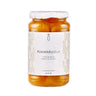 Jar of Pummarulella yellow tomatoes with a white label on a white background